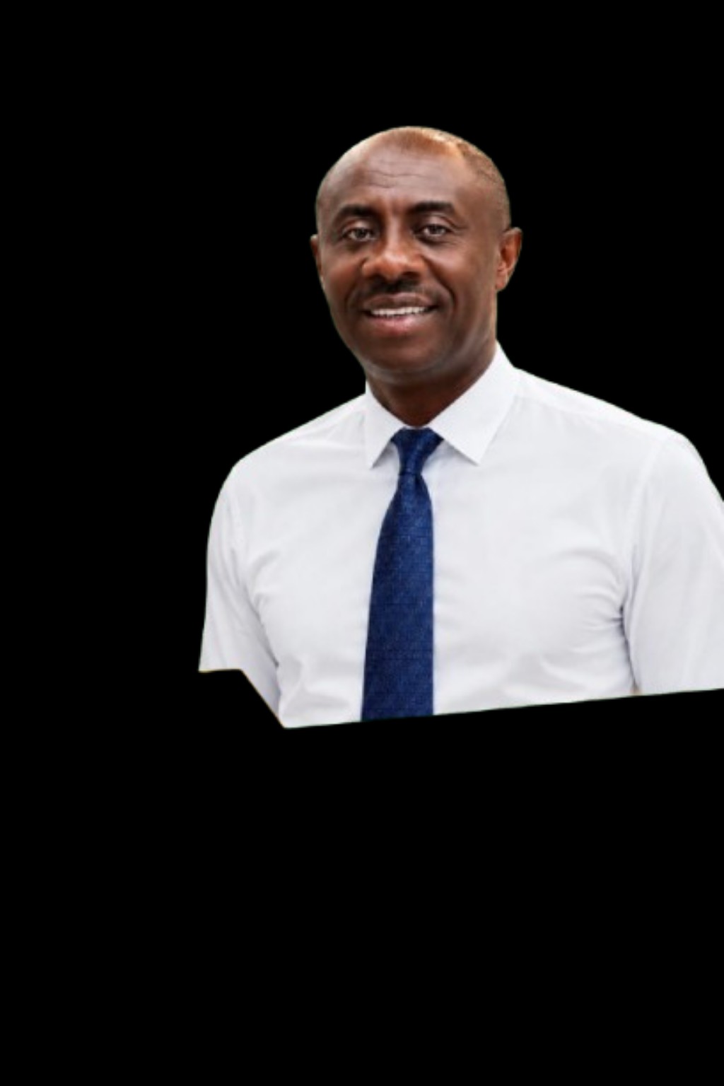 Hon. Christopher Omeresan Slater wearing a white shirt and blue tie